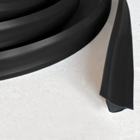 Blackout flexible trim close-up of black adhesive