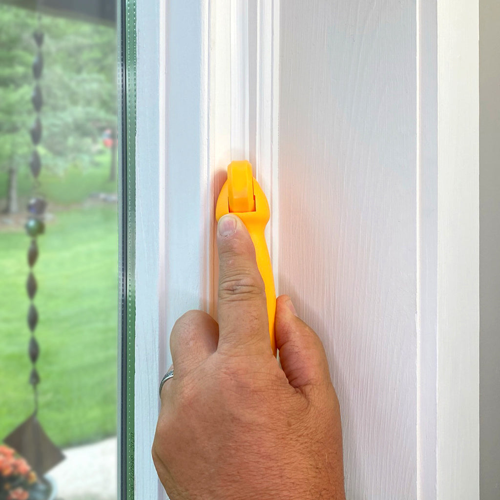 InstaTrim Applicator Tool self-adhesive trim strip and caulk strip. Trim windows to keep energy bills low.