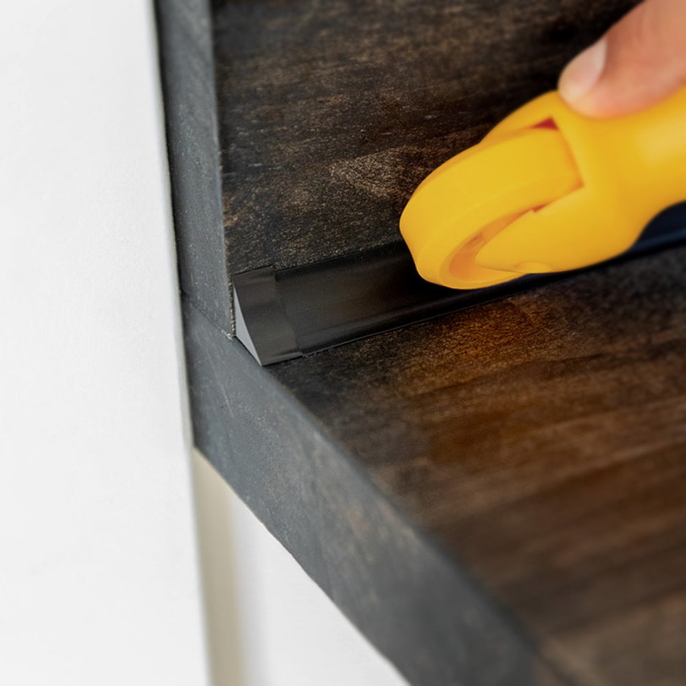 Finish an exposed trim end with a black end cap