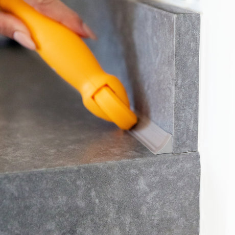 InstaTrim Applicator Tool self-adhesive trim strip and caulk strip. Counter backsplash